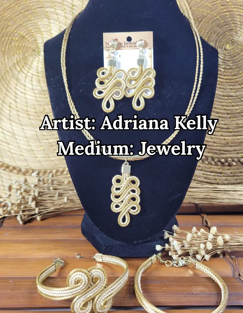 Golden woven-grass necklace, earrings, and bracelets on a black velvet bust, by Adriana Kelly