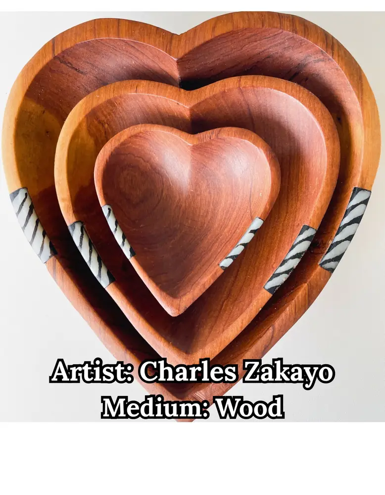 Nested carved wooden heart bowls with zebra-striped inlay, by Charles Zakayo