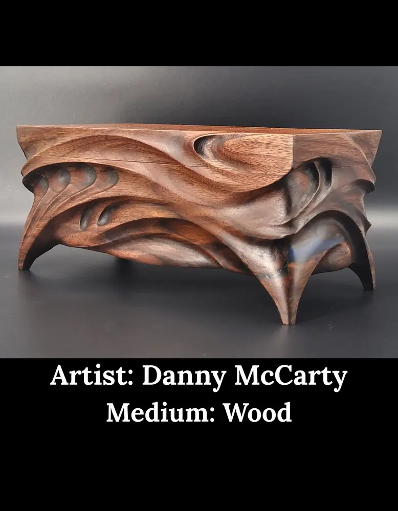 Carved walnut box with flowing curves and arched legs, by Danny McCarty
