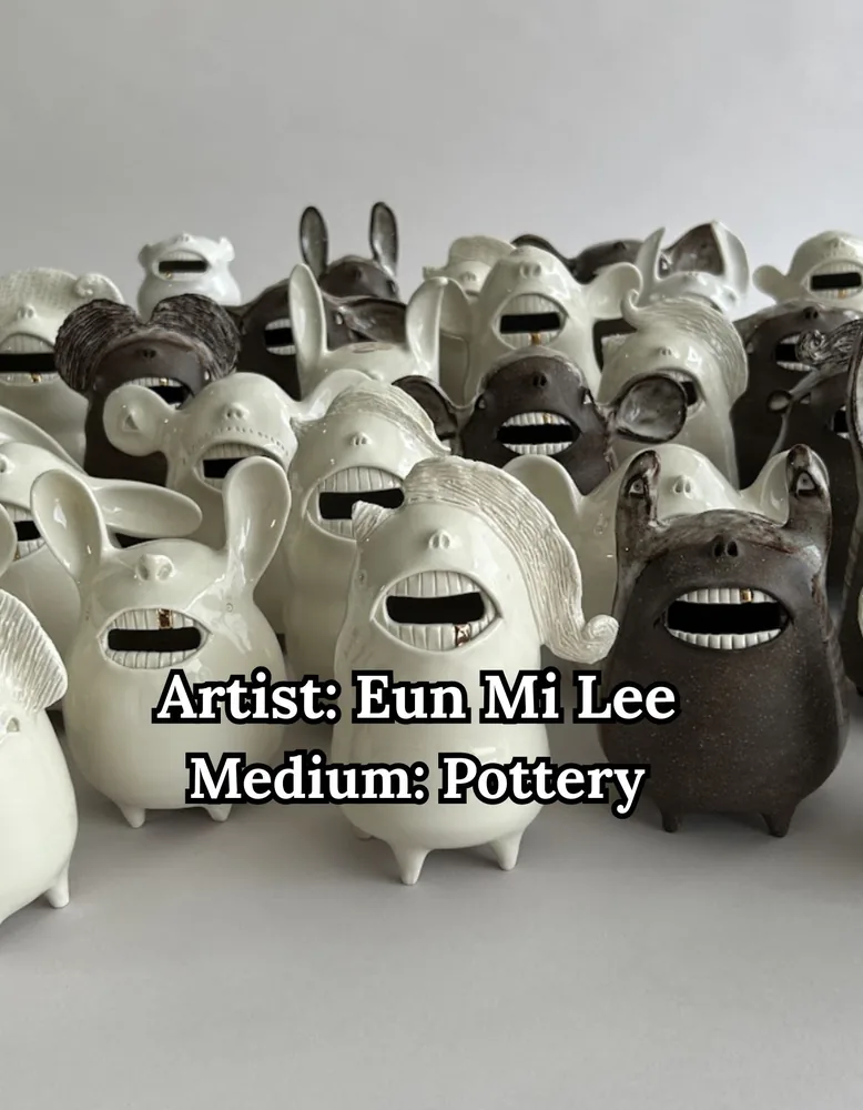 A crowd of whimsical white and brown ceramic creatures with wide toothy grins, by Eun Mi Lee
