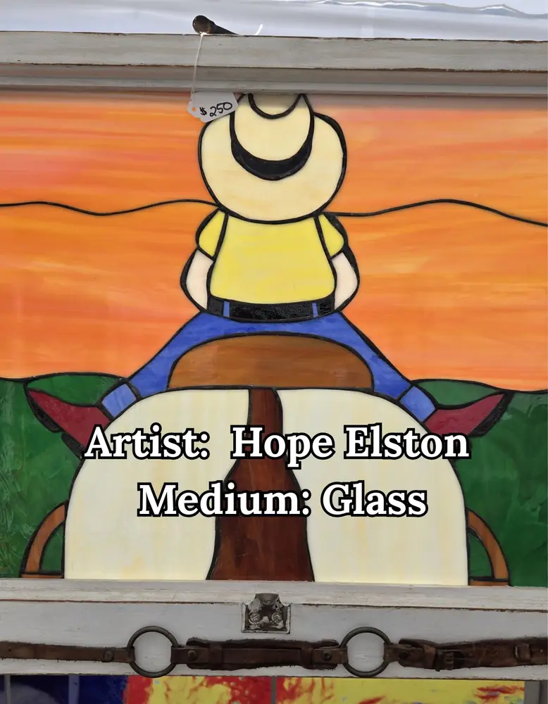 Stained-glass window of a cowboy on horseback at sunset, by Hope Elston